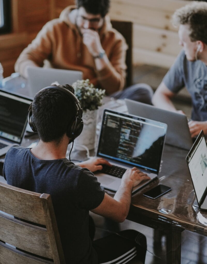 Developers at computers - prosper-digital.co.uk